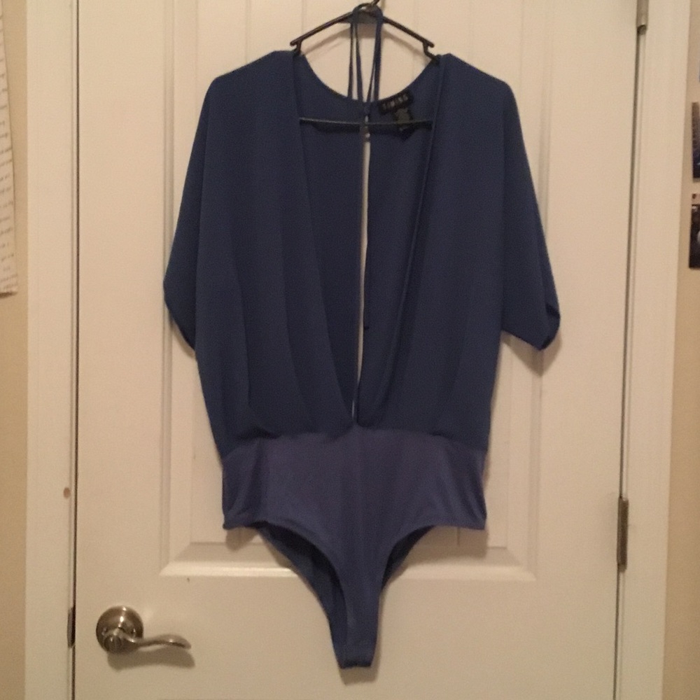 Here I have a sexy open blue bodysuit